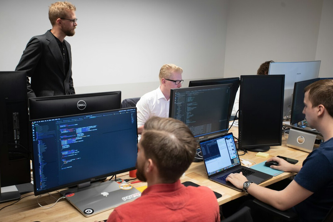 students coding together